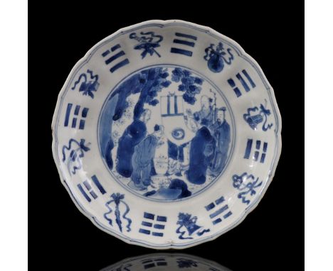 Porcelain contoured dish with blue decor of a scene with philosophers in the heart and decorated edge of 8 antiquities and tr
