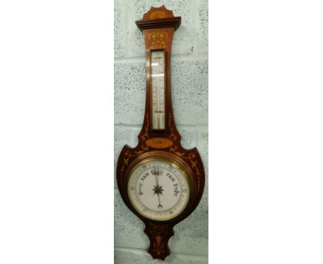 An Edwardian mahogany and marquetry wheel barometer, with opaque glass thermometer and dial, 87cm high.
