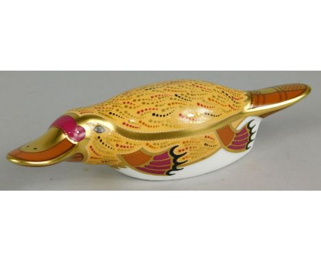 A Royal Crown Derby porcelain duckbilled platypus paperweight, from the Australian collection, gold button and certificate, l