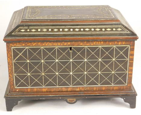 A 19thC Indian ebony and ivory box, the hinged lid with a vacant interior, decorated overall with geometric devices etc on br
