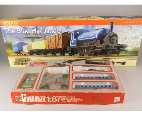 A Hornby Blue Highlander OO-gauge train set, and Lima HO-gauge electric train set, both boxed.