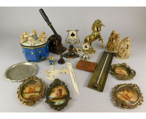 Miscellaneous items, to include a painted metal letter stamp, a pair of religious plaques, a German musical toy, brass thermo