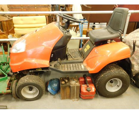 A ride on petrol mower, with Briggs and Stratton engine and some accessories, number AJ 102 18H