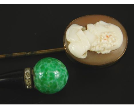A cameo set stick pin, yellow metal, unmarked and a smaller dress pin, boxed. 