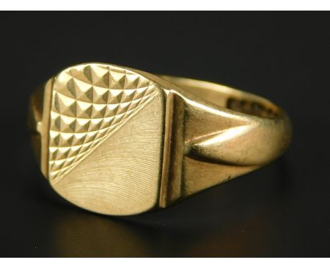 A 9ct gold dress ring, with half engine turn design shield, 4.1g all in. 