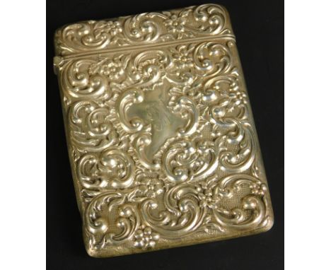 An Edwardian silver cigarette case, embellished with floriate scrolls and engraved cartouche to front portion, Birmingham 190