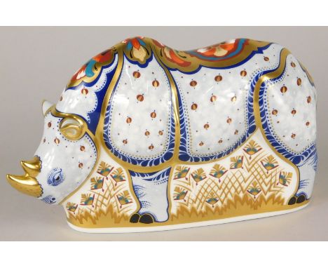 A Royal Crown Derby limited edition porcelain paperweight, the White Rhino from The Endangered Species Series no. 584/100, wi