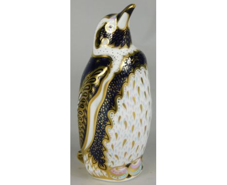 A Royal Crown Derby porcelain Galapagos penguin paperweight, indistinctly signed to underside, gold button and certificate nu