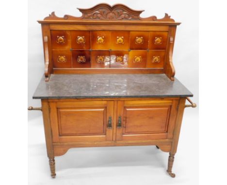 A late Victorian wash stand, the raised back inset with brown glazed tiles, the base with a variegated grey marble top, above