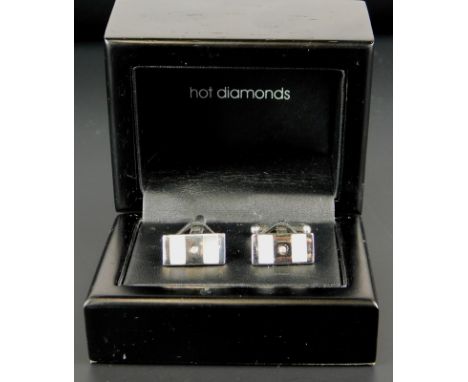 A pair of silver Hot Diamonds cufflinks, set with two mother of pearl bars, and with a central tiny diamond, boxed. 