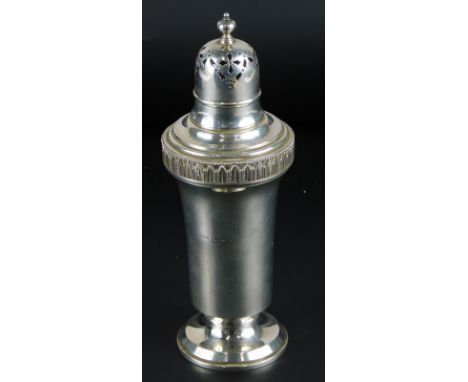 A George V silver sugar caster, decorated with a band of stylised leaves, turned finial and engraved with initials MF, London