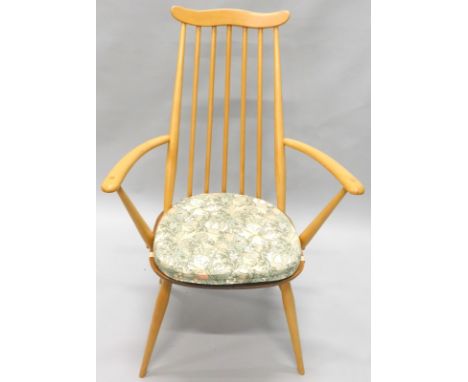 An Ercol pale beech stick back open armchair, on turned legs
