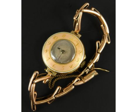 A 15ct gold Hamilton & Co of Calcutta ladies enamel wristwatch, the circular watch head, with a peach enamel surround, gold n