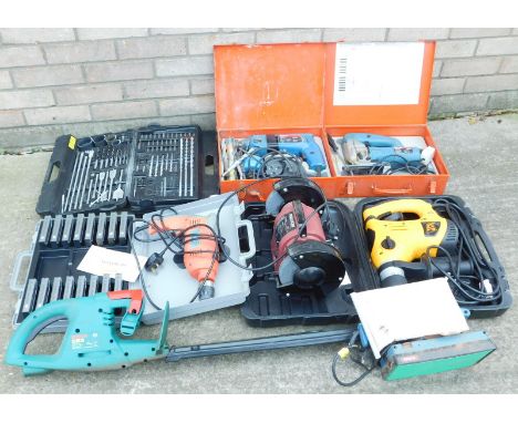 Various Bosch and other power tools, a hedge trimmer, grinder, a drill, and a sander etc.