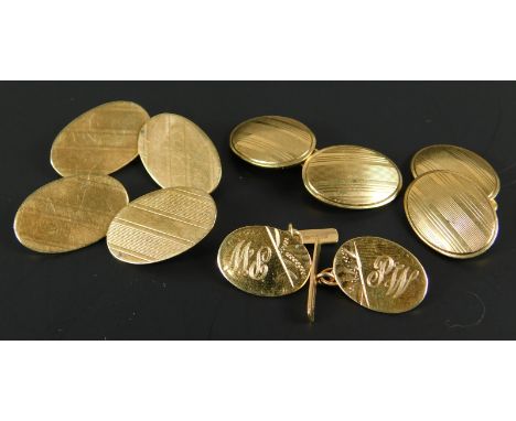Three pairs of 9ct gold cufflinks, each oval with engine turn design, 17.1g all in.