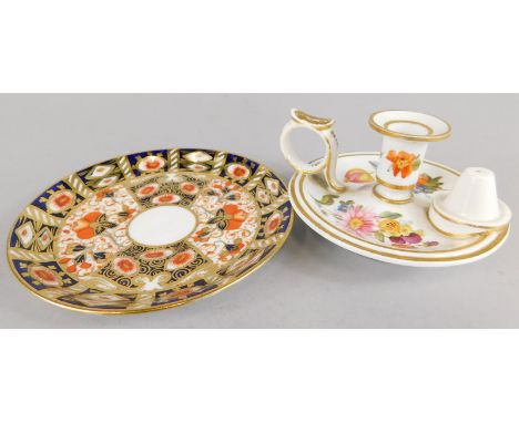 A 19thC Derby chamber candlestick, painted with flowers and a Davenport Imari saucer
