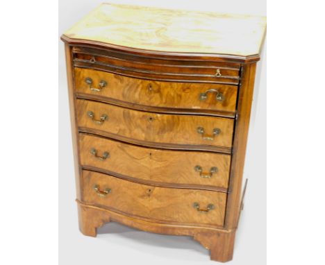 A walnut serpentine fronted chest of drawers, the quarter veneered top with a crossbanded border, above a brushing slide and 