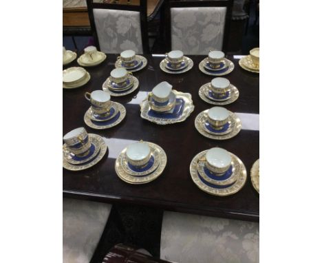 PARAGON TEA SERVICE, with floral and gilt decoration, comprising 12 side plates, 12 saucers, 12 cups, sugar, cream and cake p