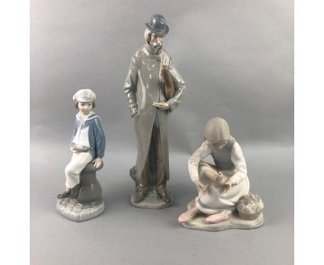 LLADRO FIGURE OF A VIOLINIST, 34cm high, along with another Lladro figure and a Nao figure (3)