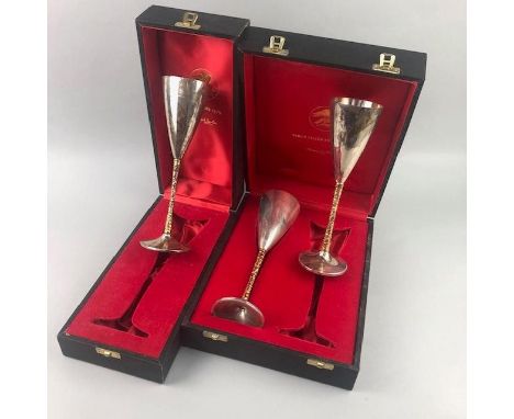 PAIR OF SILVER CHAMPAGNE FLUTES, by Stuart Devlin, in fitted case, along with a single silver champagne flute by Stuart Devli