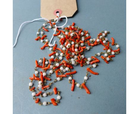 A long coral and jade necklace 