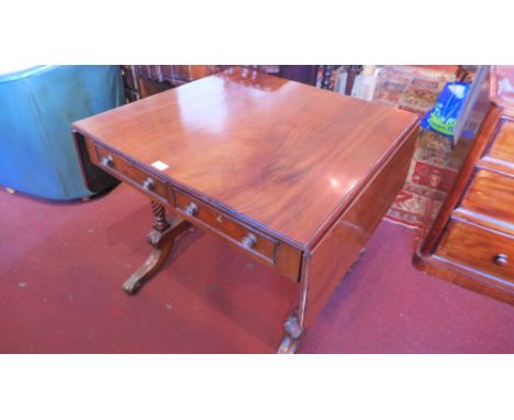 A Georgian Irish mahogany sofa table with two short drawers and two faux drawers, raised on rope twist supports joined by a r