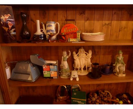 A mixed collection including mirrors, K9 robot dog, tribal figures