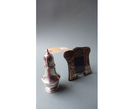 A 1930's hallmarked silver sugar shaker together with a hallmarked silver photograph frame 