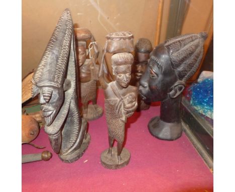 A collection of five carved African hardwood figures including a portrait bust of a lady 