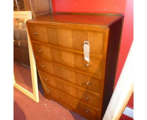 A vintage oak chest of five long drawers
