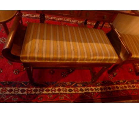 A mahogany duet stool having Regency stripe upholstery together with another mahogany piano stool in the same fabric