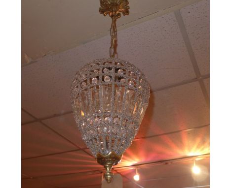 A basket form chandelier of tapering form with gilt metal mount