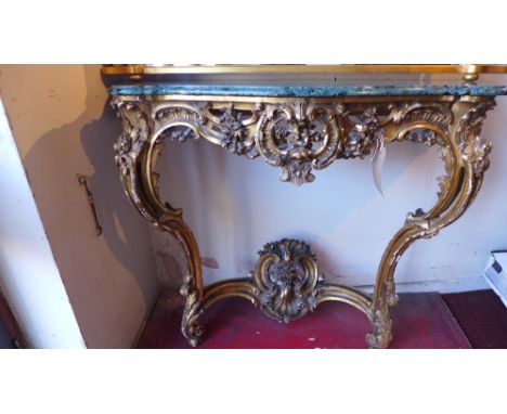 A 19th century neo-rococo gilt console table of ornate form, with green marble top 