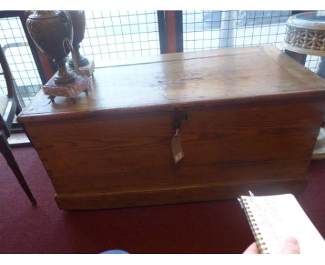 A large Victorian pine trunk with rope carrying handles 