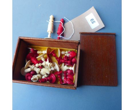 A quantity of 1920's ivory and stained ivory chess pieces with box