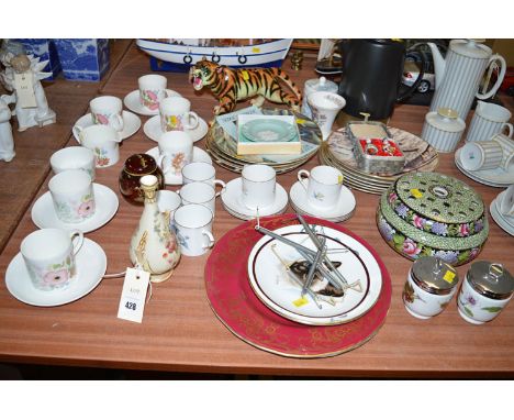 A Royal Worcester small two-handled vase, with floral decoration on ivory ground; six Royal Worcester coffee cans and saucers