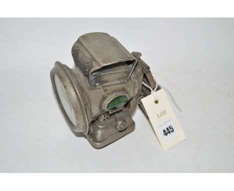 Joseph Lucas Limited: a "Silver King" paraffin bicycle lamp, with clear circular lens and oval faceted sided lenses.