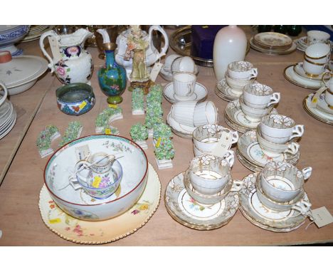 A Victorian part afternoon tea set decorated hand-painted flowers and centre panels with grey and gold coloured borders; anot