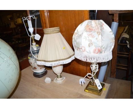 A early 20th Century small brass corinthian column pattern table lamp; a Japanese ware table lamp; and another table lamp. (3