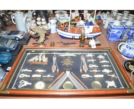 A model of the Cutty Sark; a brass fish; a selection of nautical items; together with a miniature miner's safety lamp.