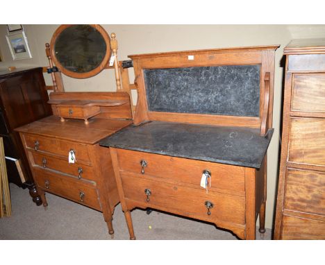 An oak dressing chest, the bevelled oval mirror above single jewellery drawer and shelf, three drawers below raised on turned