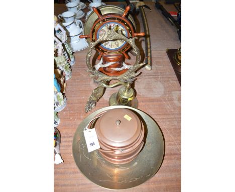 A copper biscuit barrel; a brass bell and bracket; an engraved brass bowl; together with another ship's wheel clock; a wooden