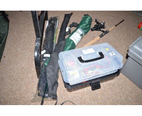 A cantilever box of various fishing tackle, a spinning rod and reel, a landing net and an outdoor folding stool. 