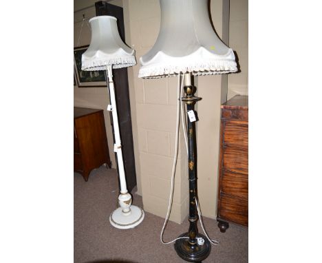 An ebonised standard lamp decorated with chinoiserie and cream coloured silk shade; together with another standard lamp with 