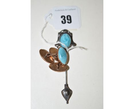 A turquoise coloured stone cabochon set Arts & Crafts pattern tie pin; together with a pair of turquoise coloured stone set c