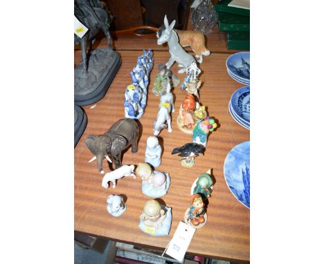 A selection of miscellaneous ware ornaments, including: a miniature Doulton 'Balloon Seller'; a Beswick elephant; a Spanish w