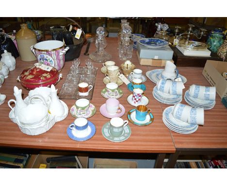 A Royal Doulton 'Cranbourne' twenty-piece tea service; a quantity of decorative coffee cans and saucers; a Coalport 'Country'