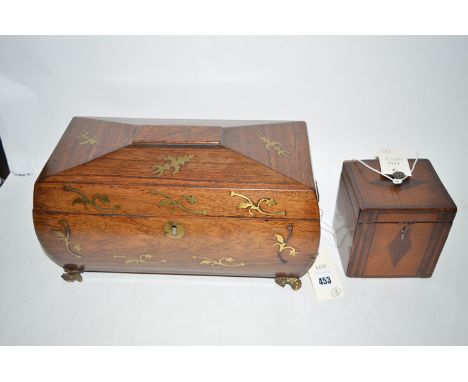 A 19th Century rosewood sarcophagus shaped tea caddy with decorative brass inlay, opening to reveal two lift-out compartments