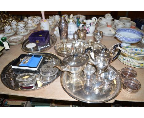 A four-piece oval EPNS tea service; a circular EPNS tray; a collection of miscellaneous plated items, including: salvers; bot