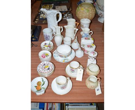 A collection of Royal Worcester jugs; small dishes; lidded jars; together with with a Locke & Co. sugar and cream jug.